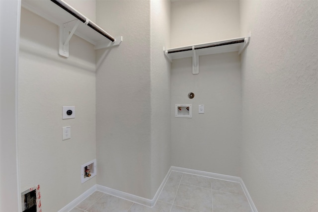 24014 Bluestem Ridge Ct, Katy, TX 77493 - laundry room featuring electric dryer hookup, hookup for a washing machine, light tile patterned flooring, and hookup for a gas dryer