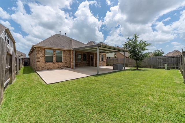 24014 Bluestem Ridge Ct, Katy, TX 77493 - rear view of property featuring brick siding, a patio area, a fenced backyard, and a shingled roof
