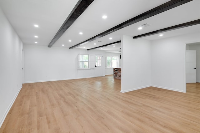 12706 Westleigh Dr, Houston, TX 77077 - unfurnished living room with beamed ceiling, recessed lighting, and light wood-type flooring