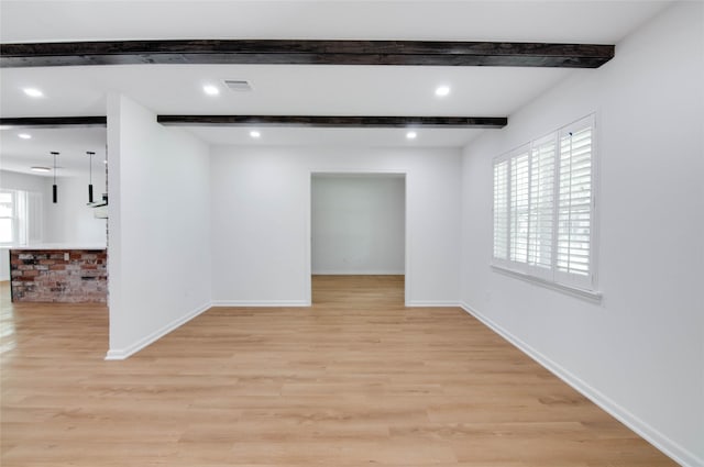 12706 Westleigh Dr, Houston, TX 77077 - empty room with beamed ceiling and light wood-style flooring