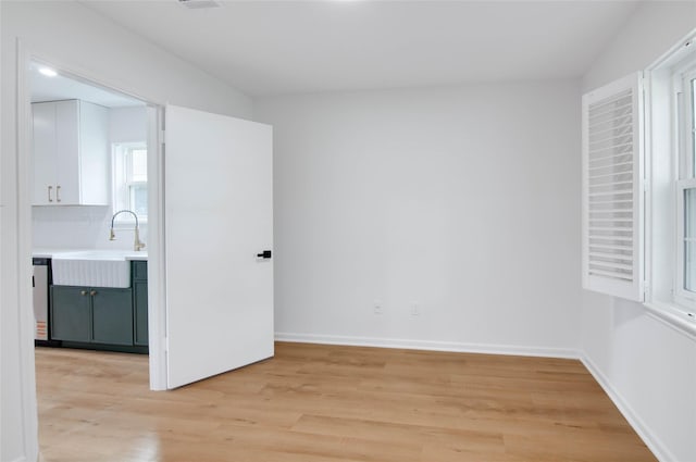 12706 Westleigh Dr, Houston, TX 77077 - unfurnished room featuring light wood-type flooring and a sink