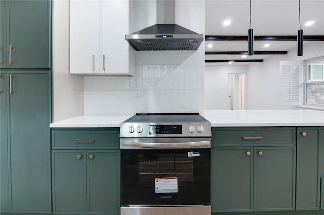12706 Westleigh Dr, Houston, TX 77077 - kitchen with green cabinets, stainless steel electric range, wall chimney exhaust hood, light countertops, and recessed lighting