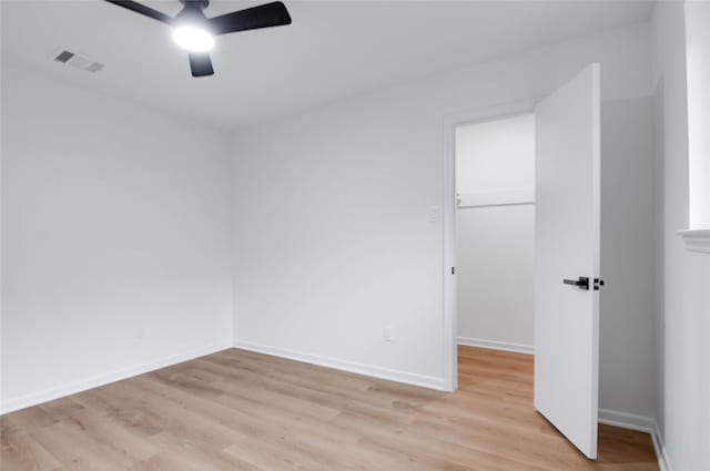 12706 Westleigh Dr, Houston, TX 77077 - empty room with ceiling fan and light wood-style flooring