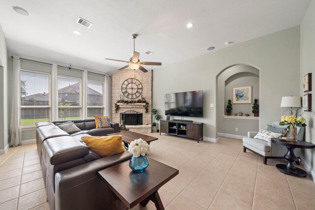 3822 Moreland Branch Ln, Katy, TX 77493 - living area with ceiling fan, light tile patterned floors, a stone fireplace, and recessed lighting