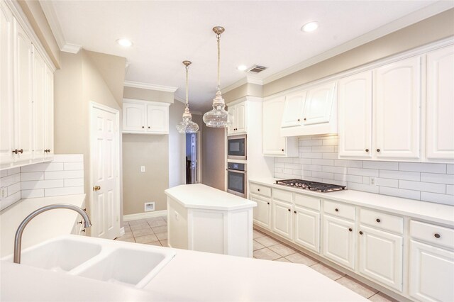 3718 W Pine Brook Way, Houston, TX 77059 - kitchen featuring appliances with stainless steel finishes, light tile patterned flooring, tasteful backsplash, crown molding, and white cabinets