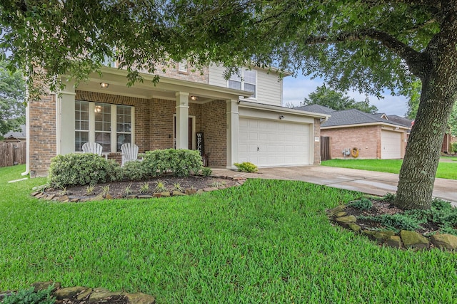 30110 Saw Oaks, Magnolia, TX 77355 - traditional-style home with brick siding, a front yard, concrete driveway, and a garage