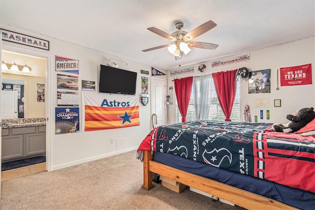 30110 Saw Oaks, Magnolia, TX 77355 - bedroom featuring carpet floors, connected bathroom, a textured ceiling, and a ceiling fan