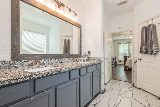 30110 Saw Oaks, Magnolia, TX 77355 - ensuite bathroom with double vanity and marble look tile flooring