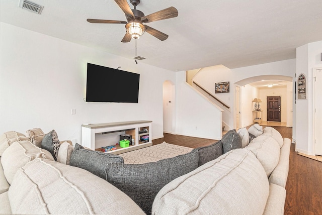 30110 Saw Oaks, Magnolia, TX 77355 - living room with arched walkways, a ceiling fan, wood finished floors, and stairs