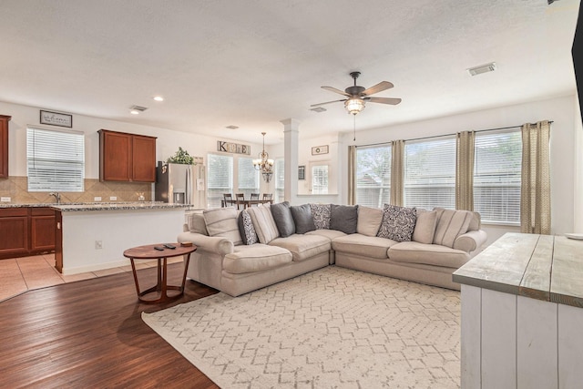 30110 Saw Oaks, Magnolia, TX 77355 - living room with ceiling fan, wood finished floors, a chandelier, and recessed lighting