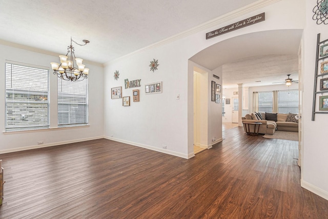 30110 Saw Oaks, Magnolia, TX 77355 - dining area with arched walkways, dark wood-style floors, ornamental molding, a ceiling fan, and a chandelier