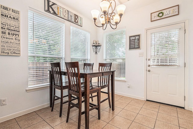 30110 Saw Oaks, Magnolia, TX 77355 - dining area featuring a chandelier and light tile patterned floors