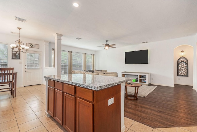 30110 Saw Oaks, Magnolia, TX 77355 - kitchen with a kitchen island, ceiling fan, light tile patterned flooring, open floor plan, and pendant lighting