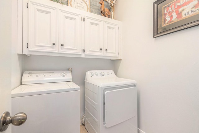 30110 Saw Oaks, Magnolia, TX 77355 - laundry room featuring washing machine and dryer and cabinet space
