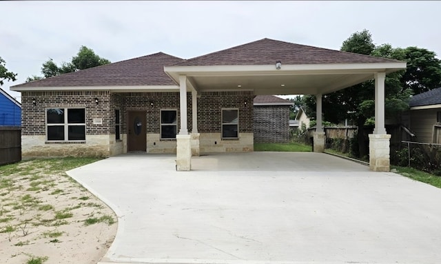 13326 Joliet St, Houston, TX 77015 - view of front of house featuring brick siding, a shingled roof, a carport, and concrete driveway