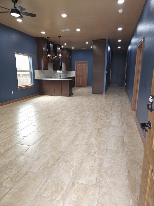 13326 Joliet St, Houston, TX 77015 - kitchen featuring open floor plan, recessed lighting, a peninsula, ceiling fan, and light countertops