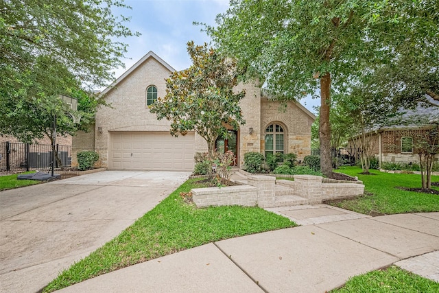 19339 Oxford Haven Dr, Cypress, TX 77433 - view of front of home with a garage, concrete driveway, stone siding, and brick siding