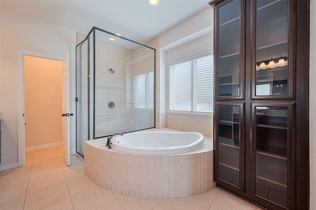 19339 Oxford Haven Dr, Cypress, TX 77433 - full bath with tile patterned flooring, a bath, a shower stall, and recessed lighting