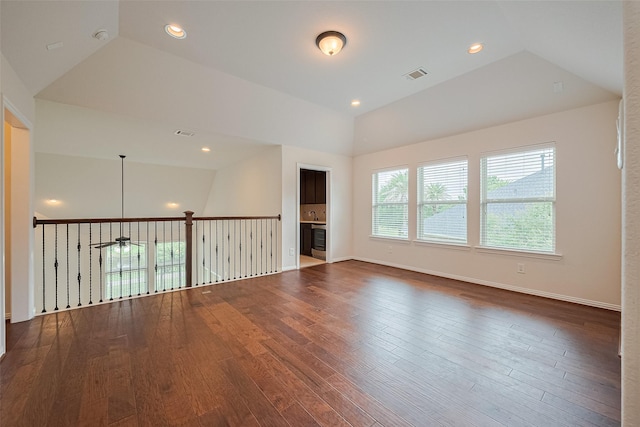 19339 Oxford Haven Dr, Cypress, TX 77433 - unfurnished room with vaulted ceiling, wood finished floors, and recessed lighting