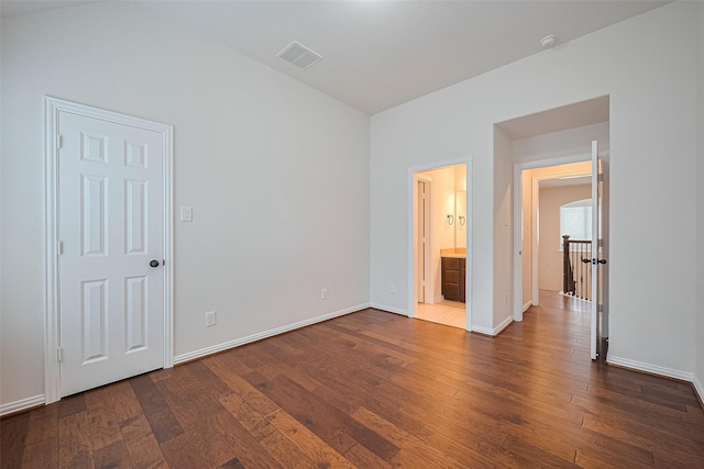 19339 Oxford Haven Dr, Cypress, TX 77433 - unfurnished bedroom with dark wood-style floors and ensuite bath