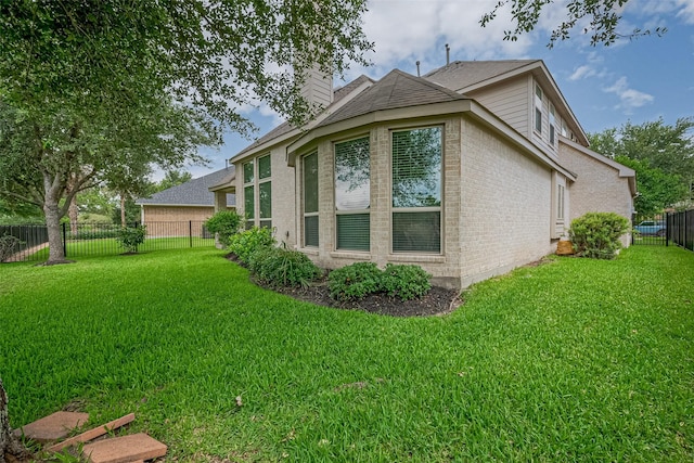 19339 Oxford Haven Dr, Cypress, TX 77433 - view of property exterior with brick siding, a chimney, a fenced backyard, and roof with shingles