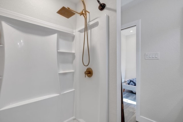 610 S Railroad Ave, Shepherd, TX 77371 - bathroom with a shower and wood finished floors