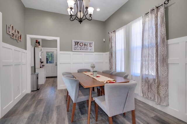 610 S Railroad Ave, Shepherd, TX 77371 - dining area with a decorative wall, a chandelier, wainscoting, and dark wood-style floors