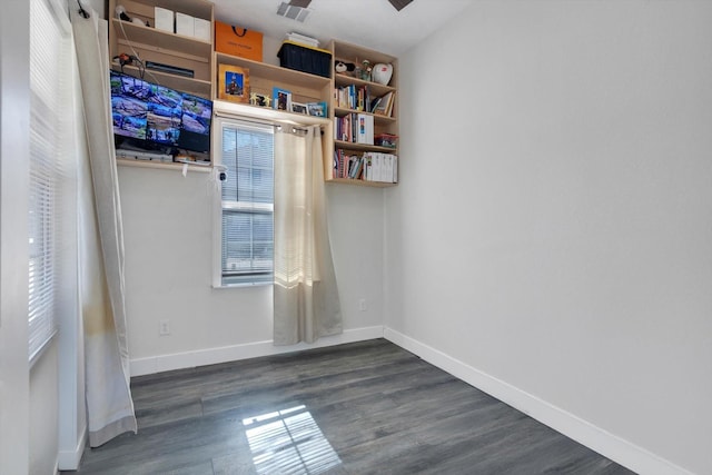 610 S Railroad Ave, Shepherd, TX 77371 - unfurnished room with dark wood-type flooring and baseboards