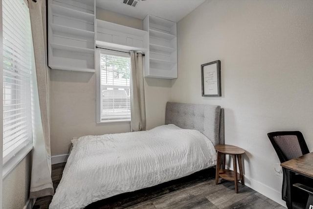 610 S Railroad Ave, Shepherd, TX 77371 - bedroom with baseboards and wood finished floors