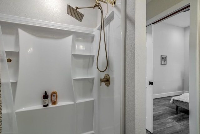 610 S Railroad Ave, Shepherd, TX 77371 - bathroom featuring a shower and wood finished floors