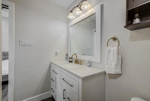 610 S Railroad Ave, Shepherd, TX 77371 - bathroom featuring vanity and a textured wall