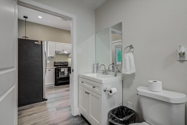 610 S Railroad Ave, Shepherd, TX 77371 - bathroom featuring vanity and wood finished floors
