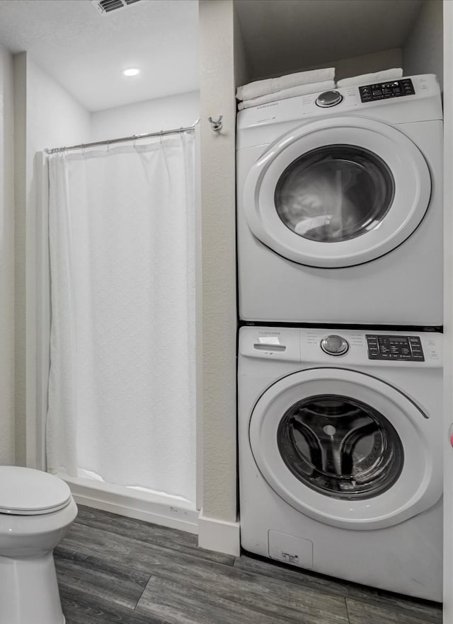610 S Railroad Ave, Shepherd, TX 77371 - laundry room with stacked washer / dryer, wood finished floors, and recessed lighting