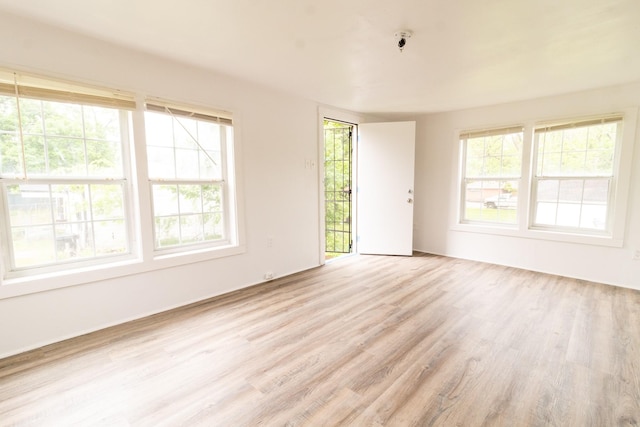 4918 Leffingwell St, Houston, TX 77026 - empty room with light wood-type flooring and a pendent fire sprinkler
