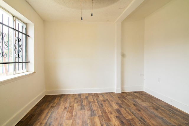 4918 Leffingwell St, Houston, TX 77026 - spare room with dark wood-style flooring and baseboards