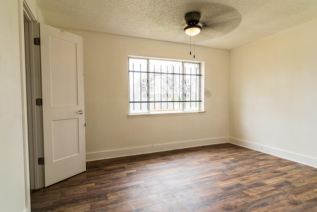 4918 Leffingwell St, Houston, TX 77026 - unfurnished room with dark wood-style flooring, a textured ceiling, and ceiling fan