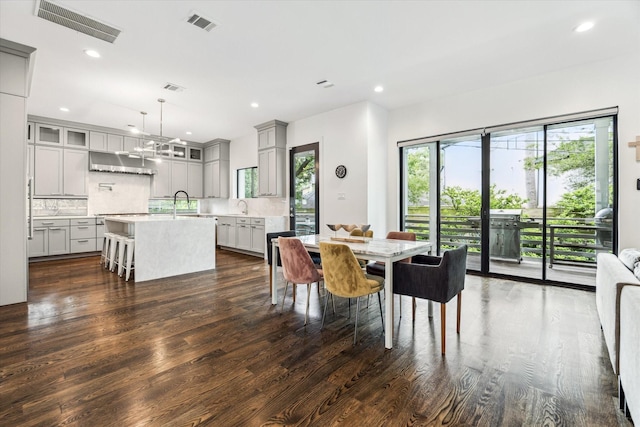 1010 Waltway Dr, Houston, TX 77008 - dining space featuring dark wood-style floors and recessed lighting