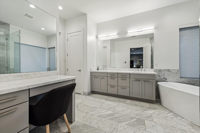 1010 Waltway Dr, Houston, TX 77008 - full bathroom featuring double vanity, a freestanding bath, a stall shower, marble finish floors, and recessed lighting