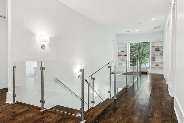 1010 Waltway Dr, Houston, TX 77008 - stairway with wood finished floors, built in shelves, and recessed lighting
