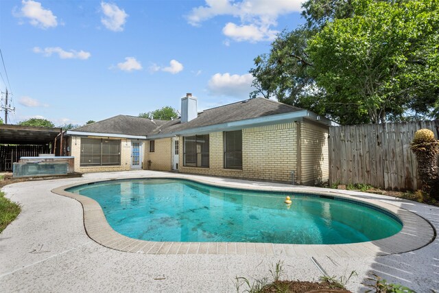 14202 Double Pine Dr, Houston, TX 77015 - view of pool with a fenced backyard, a patio, and a jacuzzi