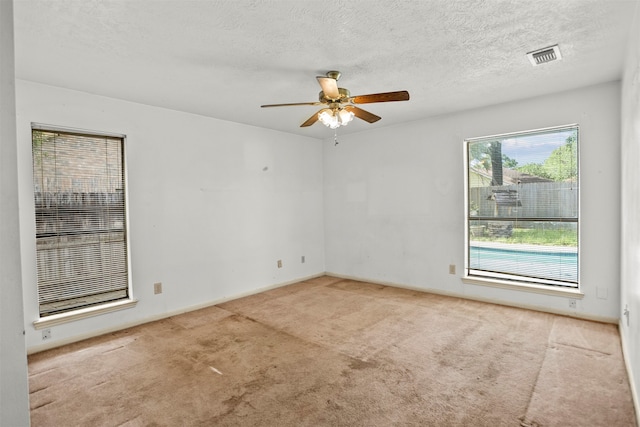 14202 Double Pine Dr, Houston, TX 77015 - spare room with ceiling fan, carpet, and a textured ceiling