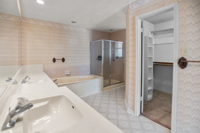 14202 Double Pine Dr, Houston, TX 77015 - full bath featuring a bath, a spacious closet, a stall shower, wallpapered walls, and tile patterned floors