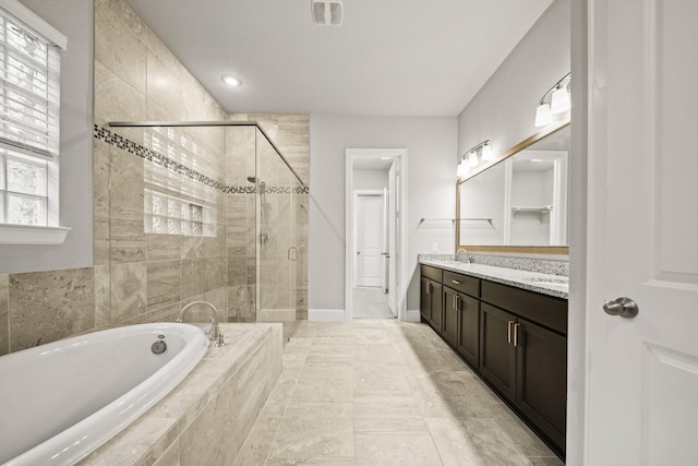 10519 Lantana Pass, Missouri City, TX 77459 - full bath featuring a garden tub, a shower stall, and double vanity