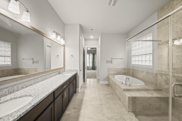 10519 Lantana Pass, Missouri City, TX 77459 - bathroom with a bath, plenty of natural light, a shower stall, and double vanity