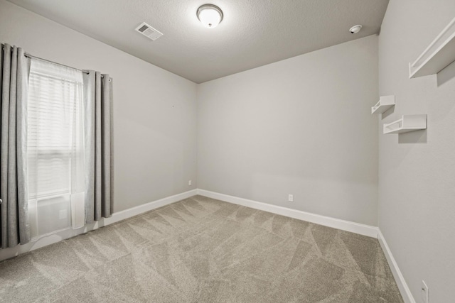 10519 Lantana Pass, Missouri City, TX 77459 - unfurnished room with carpet flooring, a smoke detector, and a textured ceiling