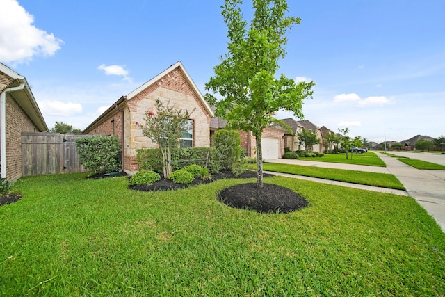 10519 Lantana Pass, Missouri City, TX 77459 - view of front facade featuring concrete driveway, stone siding, a garage, brick siding, and a residential view