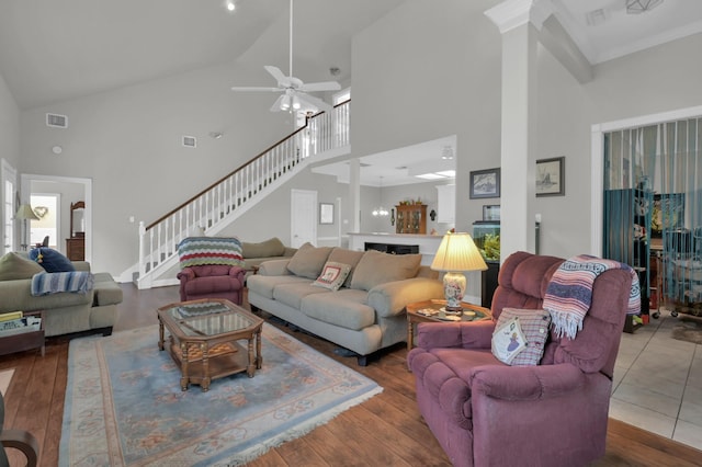4723 Cashel Castle Dr, Houston, TX 77069 - living room featuring a high ceiling, ceiling fan, stairs, and hardwood / wood-style floors