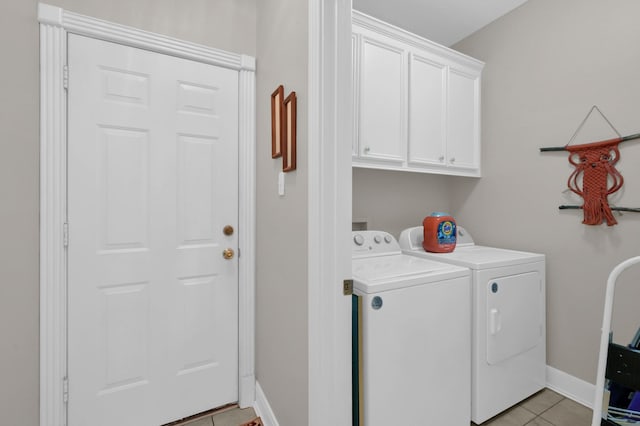 4723 Cashel Castle Dr, Houston, TX 77069 - laundry room with washer and clothes dryer, cabinet space, and light tile patterned flooring