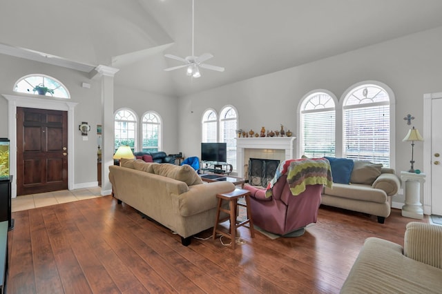 4723 Cashel Castle Dr, Houston, TX 77069 - living area featuring ceiling fan, lofted ceiling, wood finished floors, and a tiled fireplace