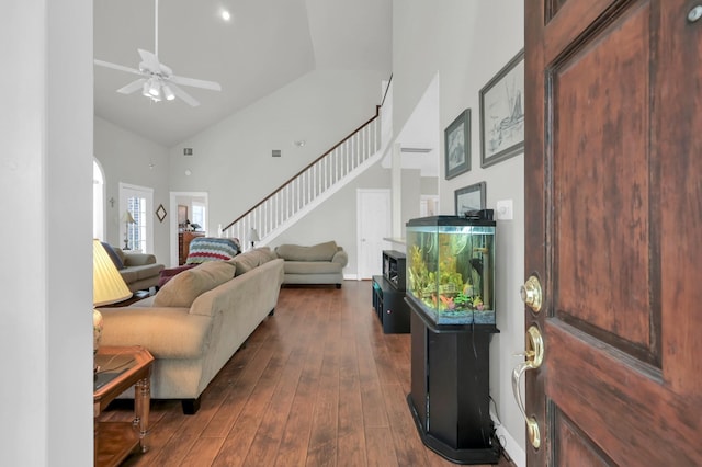 4723 Cashel Castle Dr, Houston, TX 77069 - living room with high vaulted ceiling, stairway, a ceiling fan, and dark wood finished floors